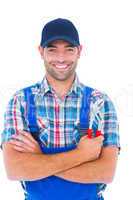 Happy repairman holding pliers on white background