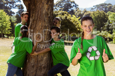 Environmental activists hugging a tree in the park