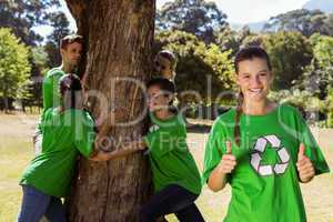 Environmental activists hugging a tree in the park