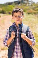 Little boy hiking in the mountains