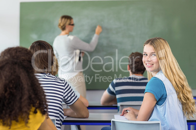 Teacher teaching students in class