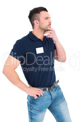 Thoughtful technician with hand on chin