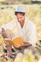 Happy man reading a book