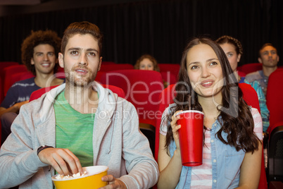 Young couple watching a film