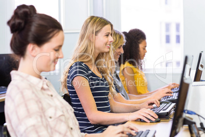 Side view of students in computer class