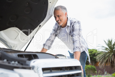 Man looking at engine