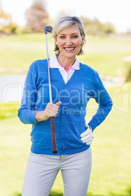 Female golfer smiling at camera