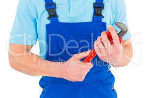 Repairman holding adjustable wrench