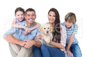 Happy family with cute dog over white background