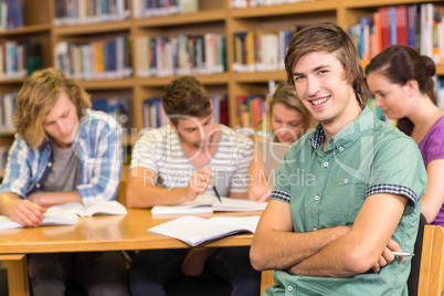 College students doing homework in library