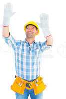 Manual worker raising hands while looking up