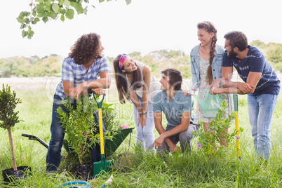 Happy friends gardening for the community