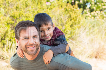 Father and son hiking through mountains