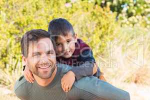 Father and son hiking through mountains