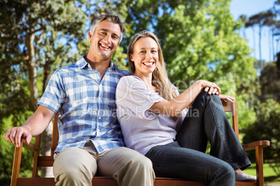 Couple relaxing in the park on bench