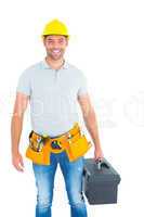 Portrait of smiling handyman holding toolbox