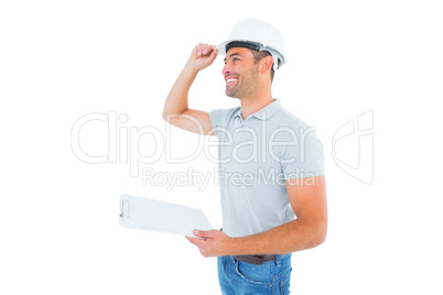 Manual worker wearing hardhat while holding clipboard