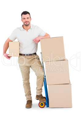 Delivery man with trolley of boxes