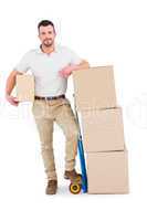 Delivery man with trolley of boxes