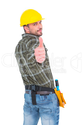 Confident manual worker gesturing thumb up