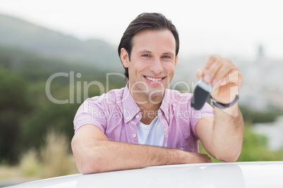 Smiling man holding key