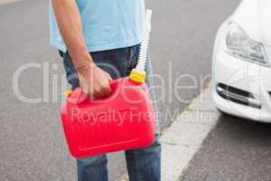 Man bringing petrol canister to a broken down car