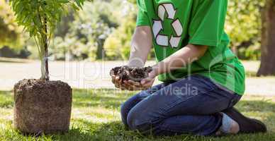 Environmental activist about to plant tree