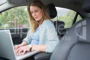 Young woman working in the drivers seat