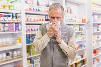 Sick customer sneezing on tissue