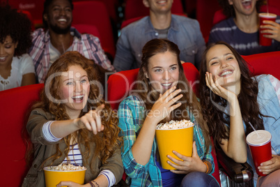 Young friends watching a film