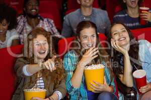 Young friends watching a film