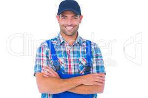 Happy repairman standing arms crossed on white background