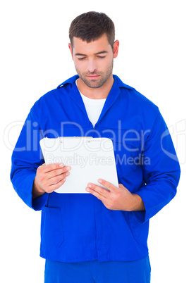 Mechanic reading clipboard