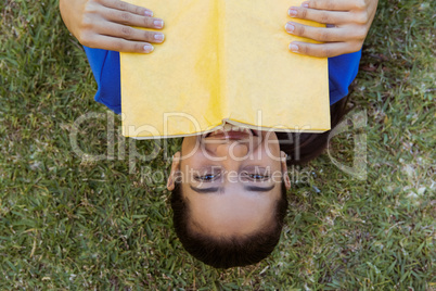 Pretty woman reading in the park