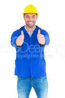 Portrait of happy manual worker gesturing thumbs up