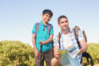 Father and son hiking in the mountains