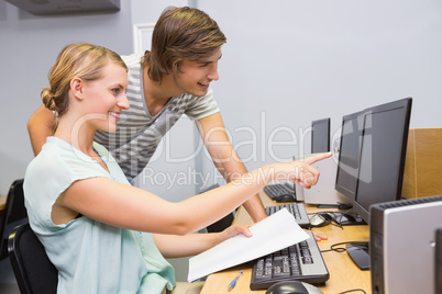 Students working on computer in classroom