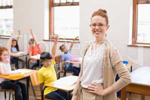 Pupils raising their hands during class