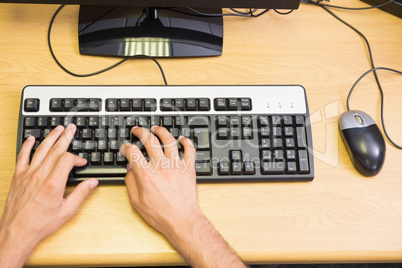 Student working on computer in classroom