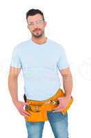 Smiling handyman with hands on hips