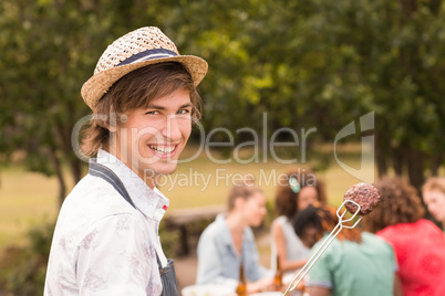 Happy friends in the park having lunch