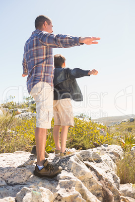 Father and son hiking in the mountains