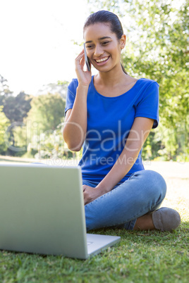Woman using phone in park
