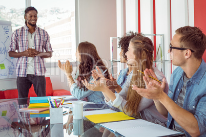 Students applaud a colleague