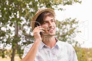 Happy young man using smartphone