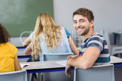 Handsome male student in class