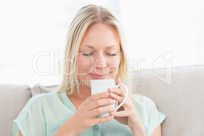 Woman enjoying coffee at home