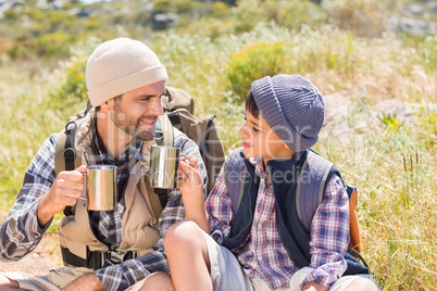 Father and son hiking in the mountains