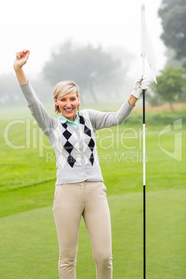 Lady golfer cheering