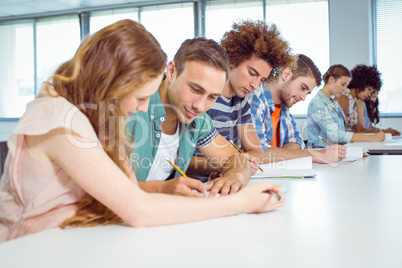 Fashion students taking notes in class
